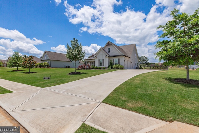 295 Graceton Farms Dr, Senoia, GA 30276 - view of front of house featuring board and batten siding, driveway, and a front yard