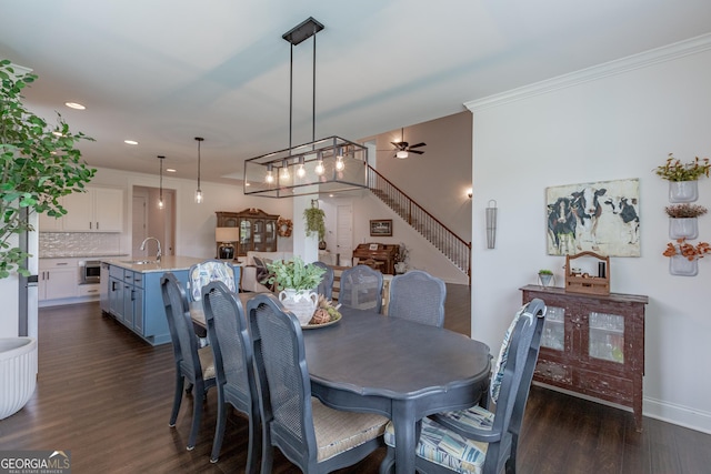 295 Graceton Farms Dr, Senoia, GA 30276 - dining room with ceiling fan, dark wood-type flooring, recessed lighting, stairway, and crown molding