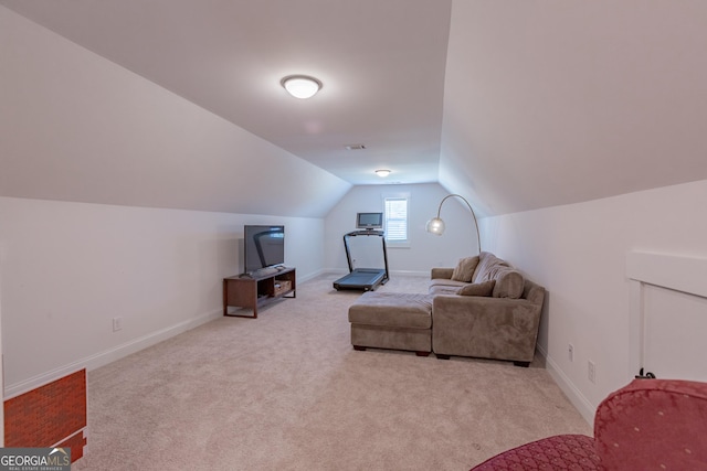 295 Graceton Farms Dr, Senoia, GA 30276 - living area with carpet flooring, vaulted ceiling, and baseboards