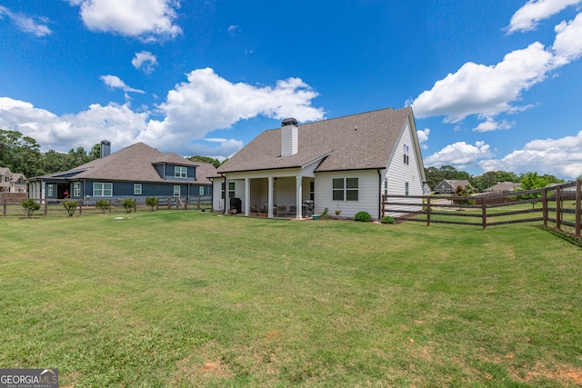 295 Graceton Farms Dr, Senoia, GA 30276 - rear view of property with a chimney, roof with shingles, and a patio area