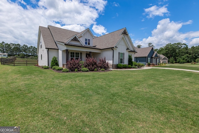 295 Graceton Farms Dr, Senoia, GA 30276 - view of front of house with board and batten siding, an attached garage, roof with shingles, and driveway