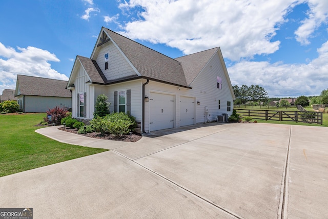 295 Graceton Farms Dr, Senoia, GA 30276 - view of side of property featuring concrete driveway, central air condition unit, roof with shingles, an attached garage, and board and batten siding