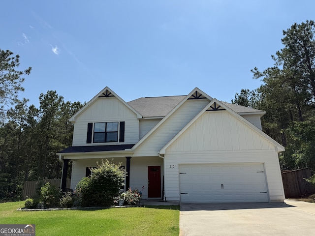 210 Fenwick Farm Dr, Lagrange, GA 30241 - view of front of property with concrete driveway, board and batten siding, an attached garage, and roof with shingles