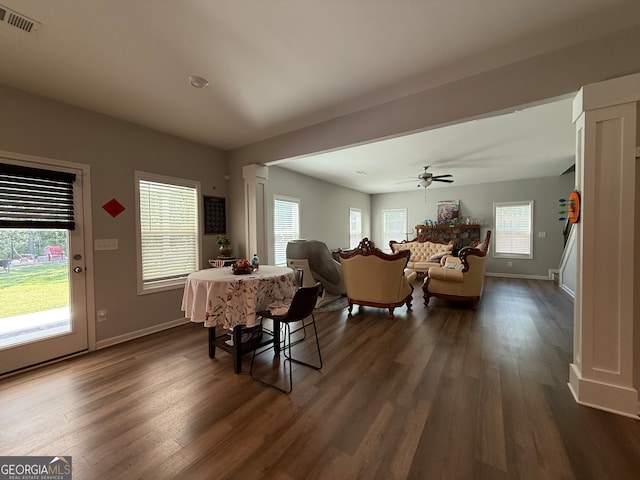 210 Fenwick Farm Dr, Lagrange, GA 30241 - dining area featuring dark wood finished floors, baseboards, and ornate columns