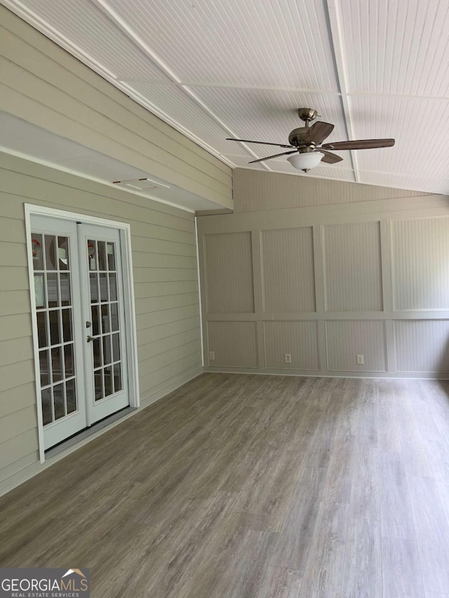 unfurnished sunroom featuring french doors and lofted ceiling