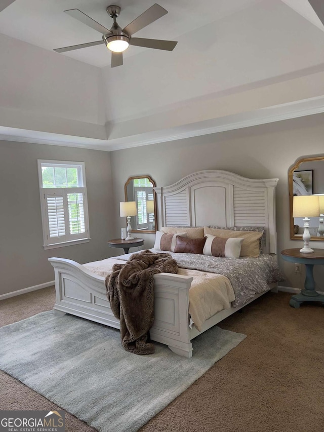 carpeted bedroom featuring baseboards, ceiling fan, and vaulted ceiling