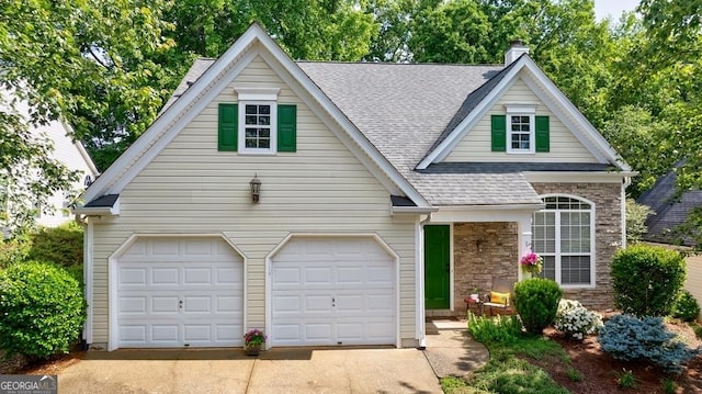 3350 Serenade Ct, Alpharetta, GA 30004 - view of front of home featuring a shingled roof, driveway, stone siding, a chimney, and a garage