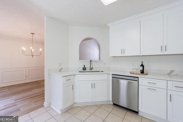 3350 Serenade Ct, Alpharetta, GA 30004 - kitchen with a sink, stainless steel dishwasher, light countertops, white cabinetry, and a chandelier