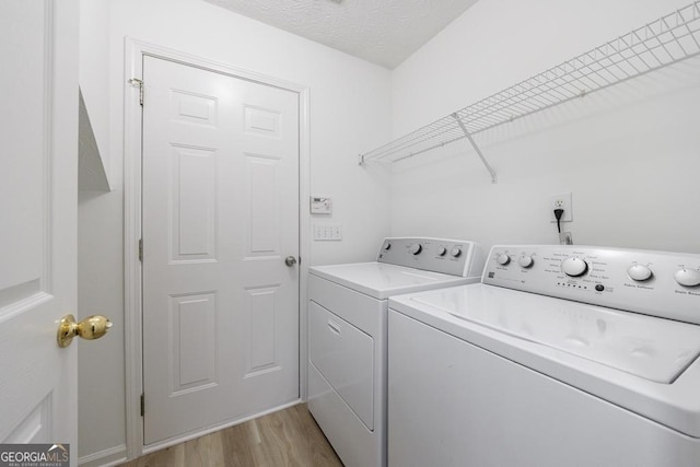 3350 Serenade Ct, Alpharetta, GA 30004 - laundry area featuring washing machine and dryer and light wood finished floors