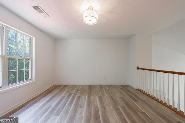 3350 Serenade Ct, Alpharetta, GA 30004 - spare room featuring wood finished floors and baseboards