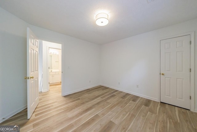 3350 Serenade Ct, Alpharetta, GA 30004 - spare room with light wood-style flooring and baseboards