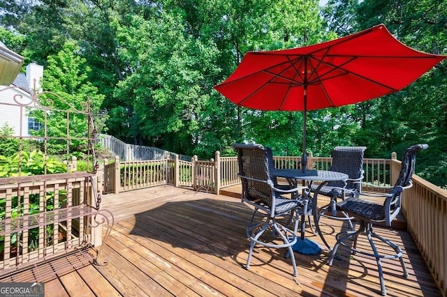 3350 Serenade Ct, Alpharetta, GA 30004 - wooden terrace featuring outdoor dining space and view of scattered trees