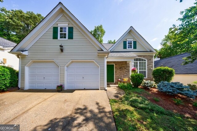 3350 Serenade Ct, Alpharetta, GA 30004 - view of front of home featuring driveway and stone siding