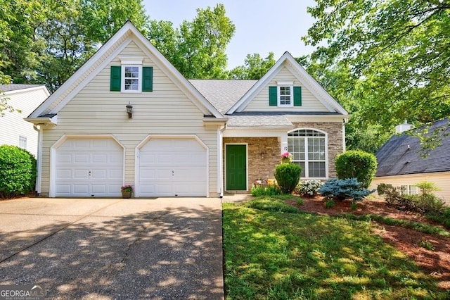 3350 Serenade Ct, Alpharetta, GA 30004 - traditional-style house featuring concrete driveway, stone siding, and roof with shingles