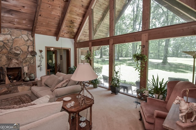 carpeted living room with high vaulted ceiling, healthy amount of natural light, beam ceiling, wood ceiling, and a fireplace