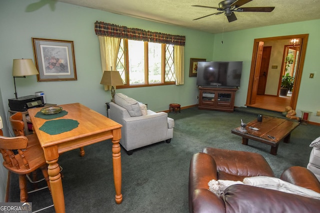 carpeted living area featuring a ceiling fan, a textured ceiling, and baseboards