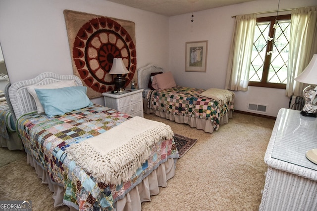 bedroom featuring light carpet