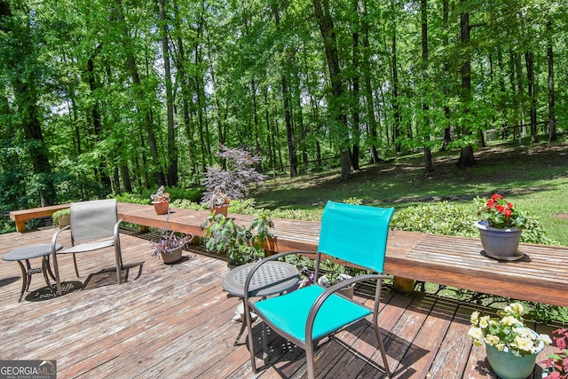 wooden deck featuring outdoor dining space