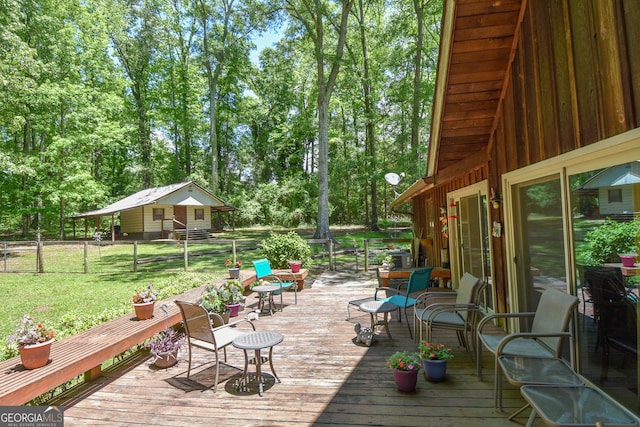 wooden terrace with view of scattered trees