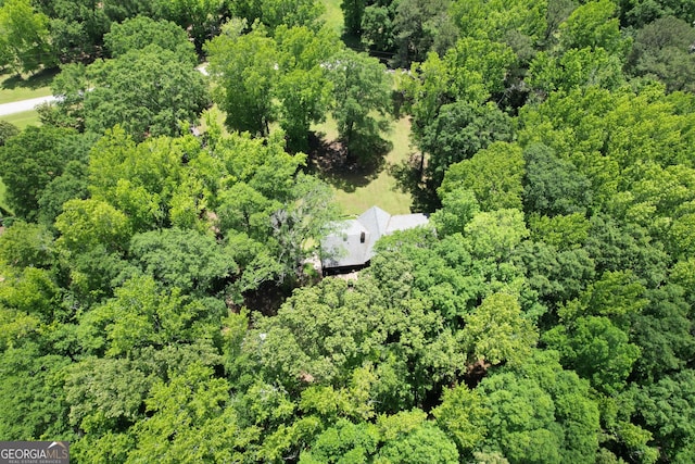 view of property location featuring a heavily wooded area