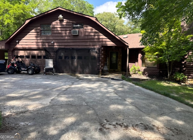 605 Smithville Church Rd, Warner Robins, GA 31088 - view of front of property with a gambrel roof, concrete driveway, and a garage