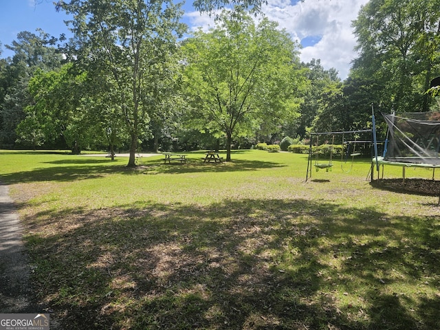 605 Smithville Church Rd, Warner Robins, GA 31088 - view of community featuring a trampoline and a yard