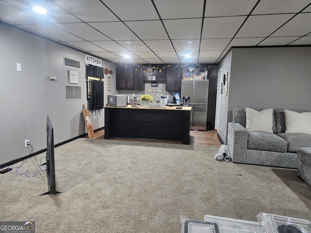 605 Smithville Church Rd, Warner Robins, GA 31088 - living area featuring light colored carpet, a drop ceiling, and baseboards