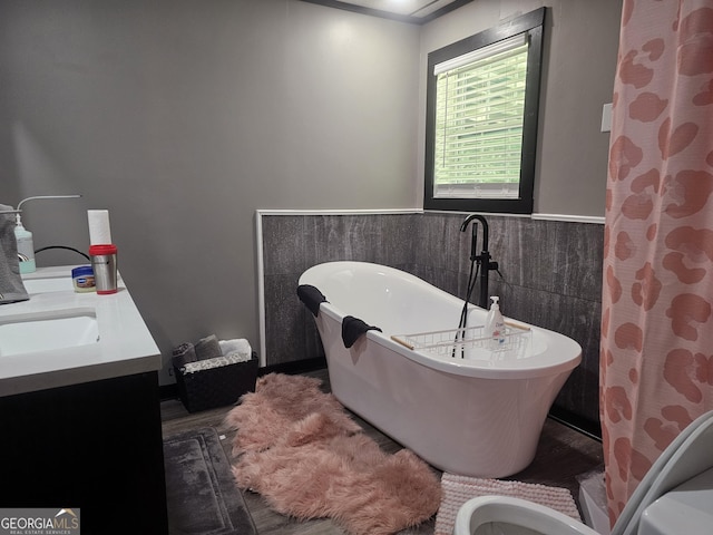 605 Smithville Church Rd, Warner Robins, GA 31088 - full bathroom featuring wainscoting, a soaking tub, tile walls, and vanity