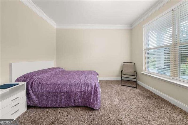 bedroom with ornamental molding, multiple windows, carpet flooring, and baseboards
