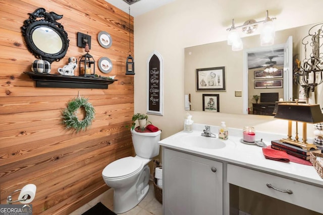 7 Stratford Dr, Athens, GA 30605 - bathroom featuring wood walls, vanity, toilet, and a ceiling fan
