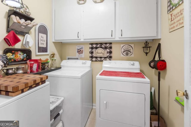 7 Stratford Dr, Athens, GA 30605 - clothes washing area featuring separate washer and dryer, cabinet space, and light tile patterned floors