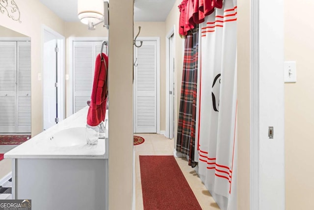7 Stratford Dr, Athens, GA 30605 - bathroom with a closet, tile patterned floors, and vanity