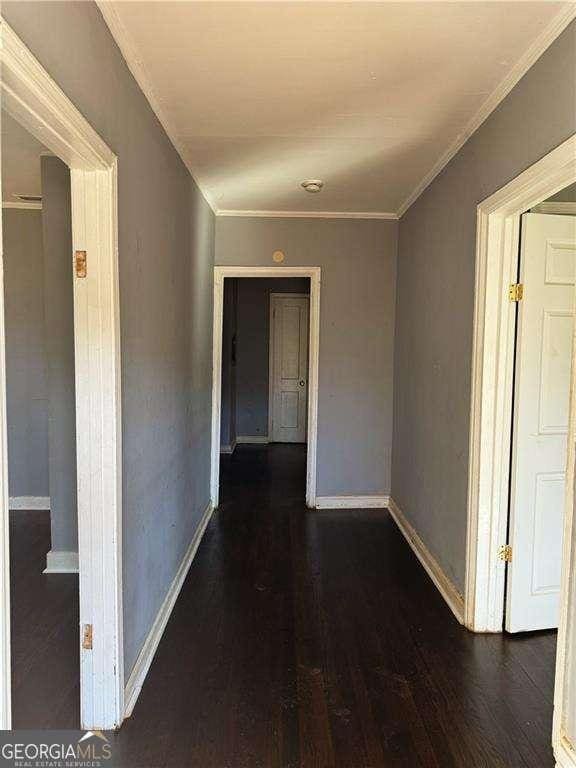 1639 Orlando St SW, Atlanta, GA 30311 - corridor featuring baseboards, wood finished floors, and crown molding