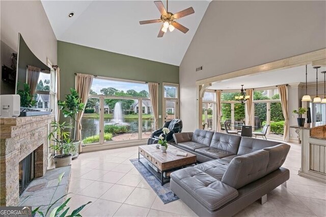 9325 Saint Georgen Cmn, Duluth, GA 30097 - living room featuring high vaulted ceiling, a chandelier, light tile patterned flooring, ceiling fan, and plenty of natural light