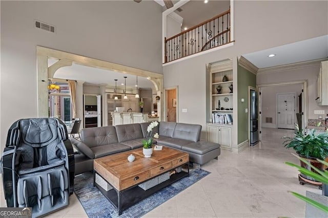 9325 Saint Georgen Cmn, Duluth, GA 30097 - living area with a towering ceiling, ornamental molding, and recessed lighting