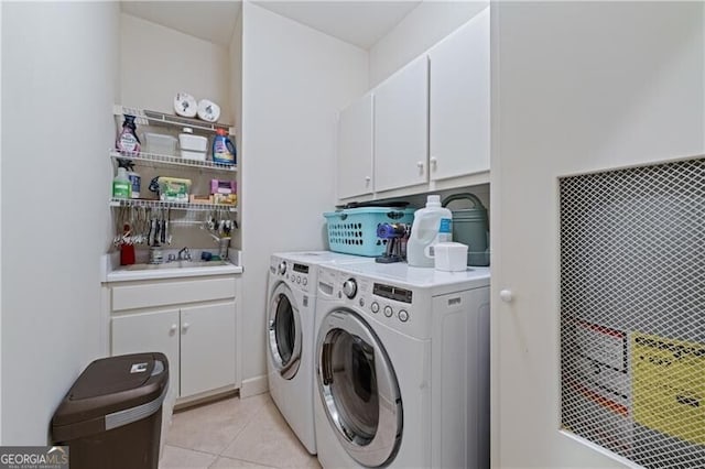 9325 Saint Georgen Cmn, Duluth, GA 30097 - laundry area with separate washer and dryer, cabinet space, and light tile patterned floors