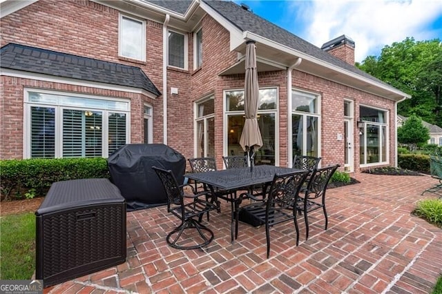 9325 Saint Georgen Cmn, Duluth, GA 30097 - view of patio / terrace with a grill and outdoor dining area
