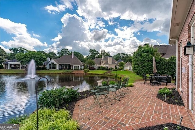 view of patio featuring a water view and a residential view
