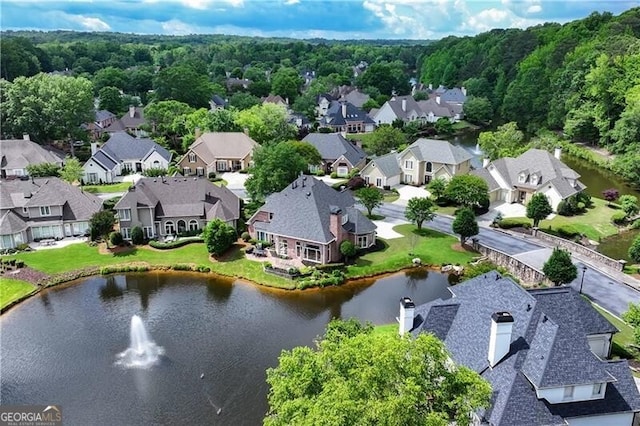 aerial view of residential area featuring a nearby body of water