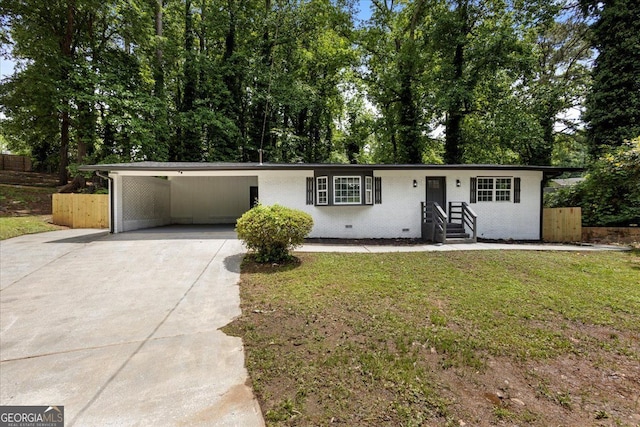 view of front facade featuring driveway and an attached carport
