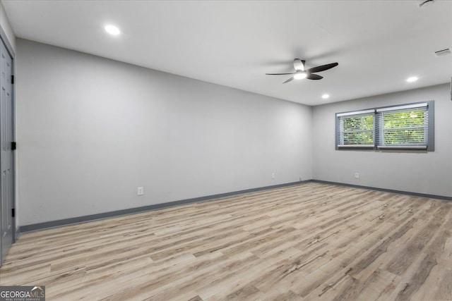 spare room with ceiling fan, light wood-type flooring, baseboards, and recessed lighting