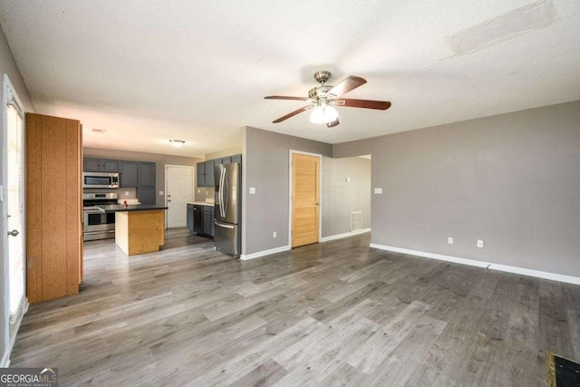 3730 Warriors Path, Decatur, GA 30034 - unfurnished living room featuring a ceiling fan, wood finished floors, and baseboards