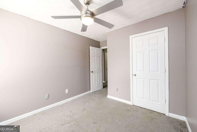 3730 Warriors Path, Decatur, GA 30034 - unfurnished bedroom featuring carpet, baseboards, ceiling fan, and a textured ceiling