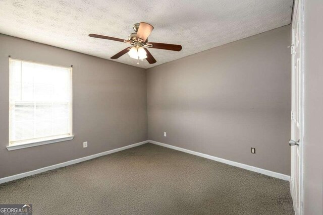 3730 Warriors Path, Decatur, GA 30034 - unfurnished room with carpet floors, baseboards, a ceiling fan, and a textured ceiling