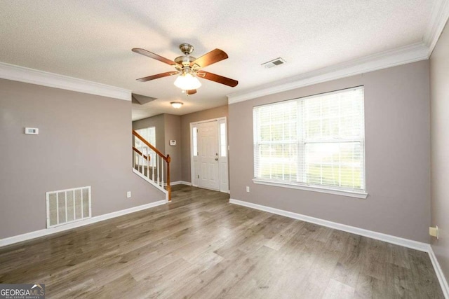 3730 Warriors Path, Decatur, GA 30034 - entrance foyer with crown molding, stairs, a ceiling fan, a textured ceiling, and wood finished floors