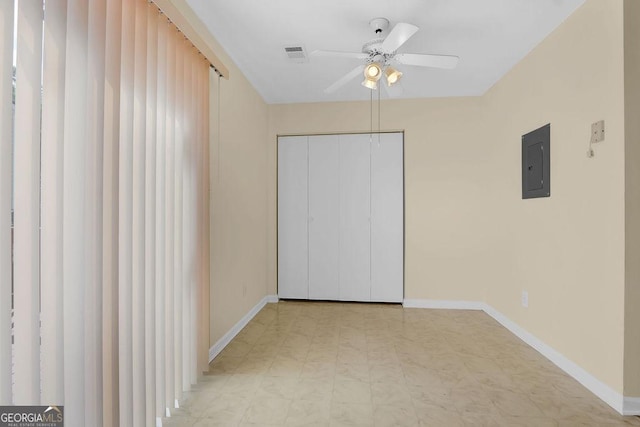 6359 Wedgeview Dr, Tucker, GA 30084 - unfurnished bedroom with electric panel, light flooring, baseboards, and a closet