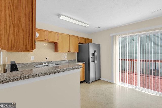 6359 Wedgeview Dr, Tucker, GA 30084 - kitchen featuring stainless steel fridge, a sink, light floors, and tasteful backsplash