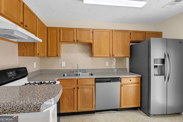 6359 Wedgeview Dr, Tucker, GA 30084 - kitchen featuring appliances with stainless steel finishes, a sink, under cabinet range hood, decorative backsplash, and light countertops