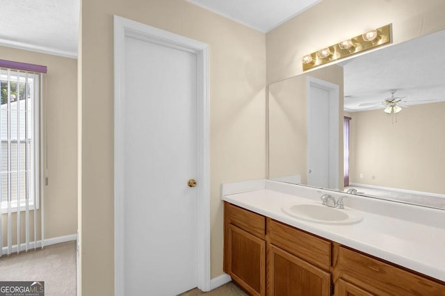 6359 Wedgeview Dr, Tucker, GA 30084 - bathroom with vanity, a ceiling fan, and baseboards