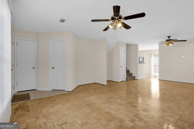 6359 Wedgeview Dr, Tucker, GA 30084 - unfurnished living room featuring ceiling fan, baseboards, and stairs